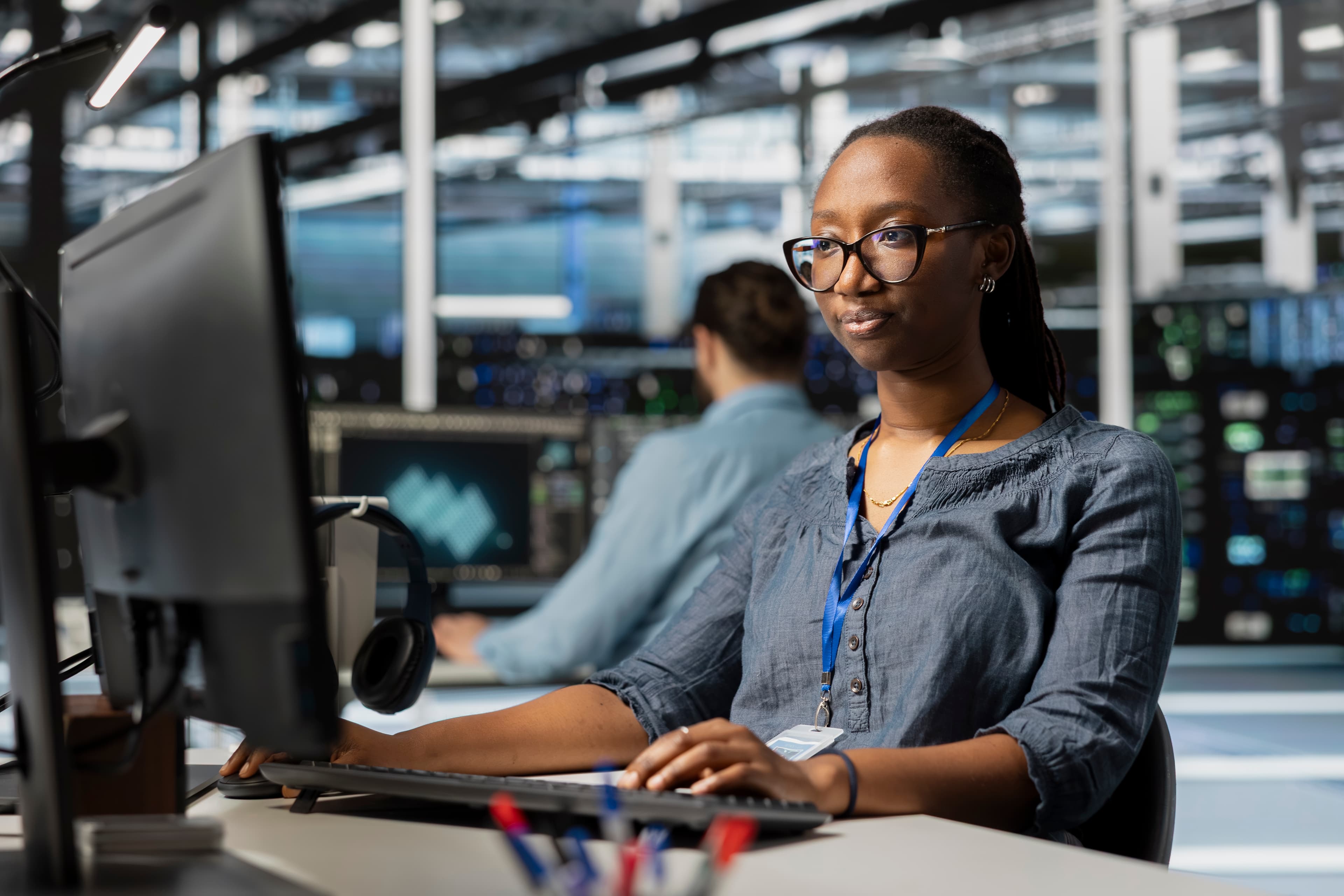 Telecom engineer at a computer.